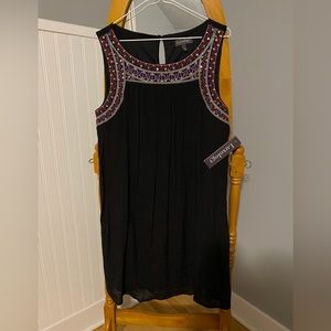 Luxology summer dress with cute trim with beads and embroidery.